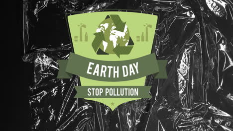 animation of earth day text and recycling icon over black plastic