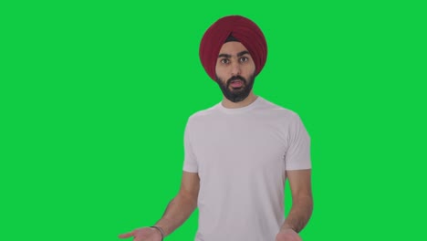 angry sikh indian man fighting with someone green screen