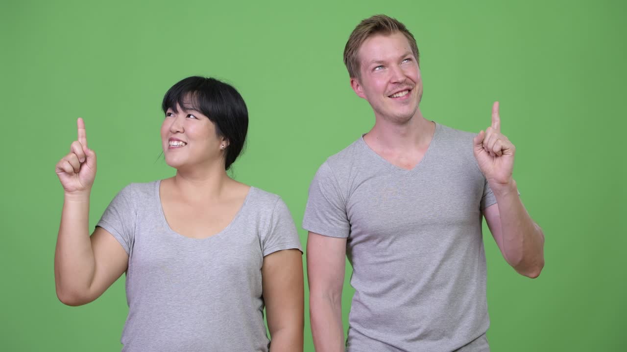 Happy young multi-ethnic couple having an idea together