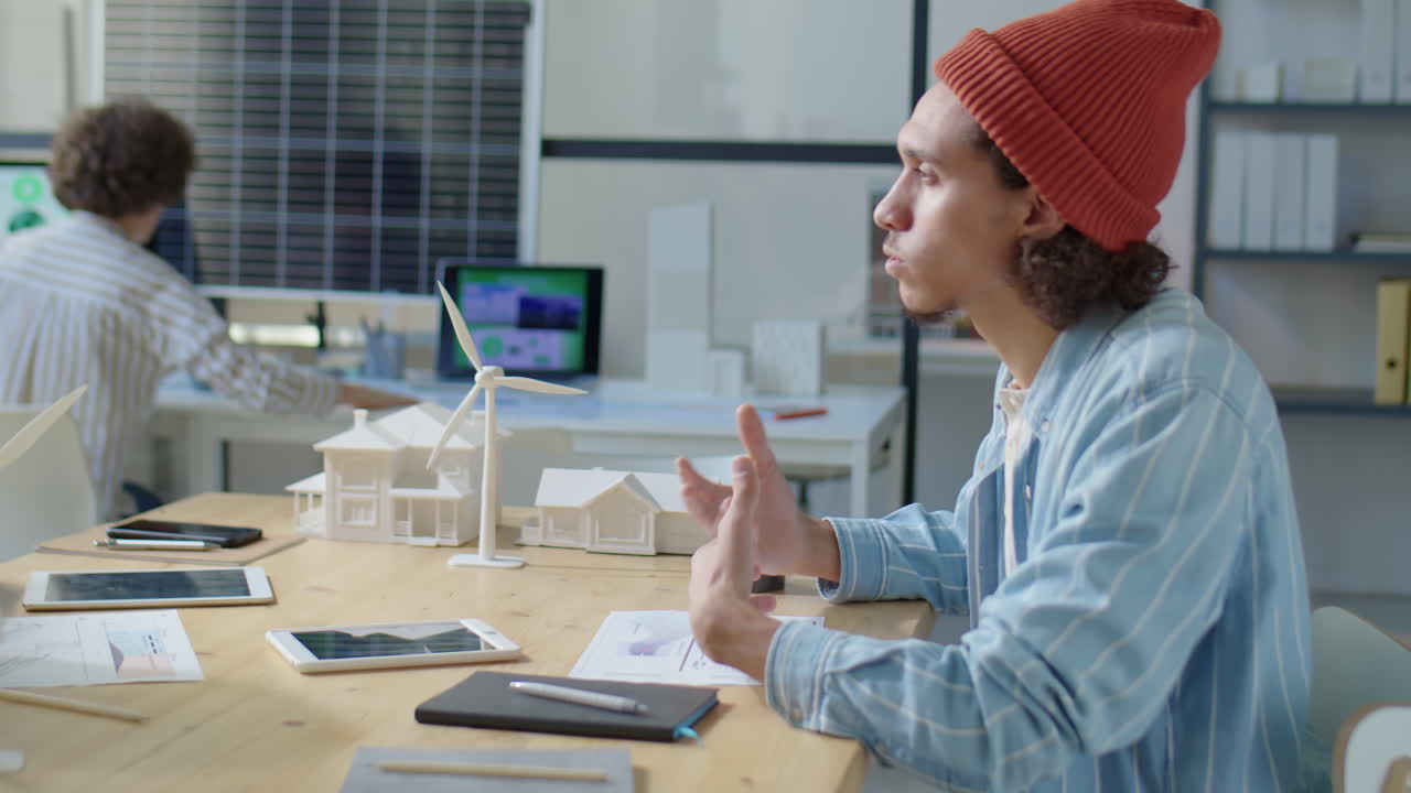 Male Engineers Discussing Renewable Energy Project