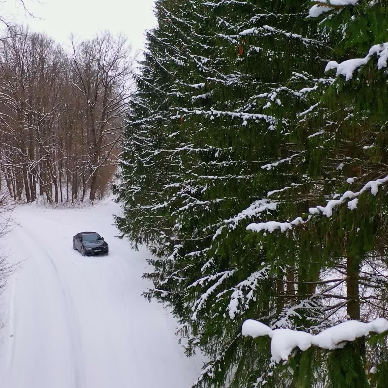 Winter country road with car