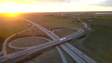 aerial view of freeway intersection with moving traffic cars.