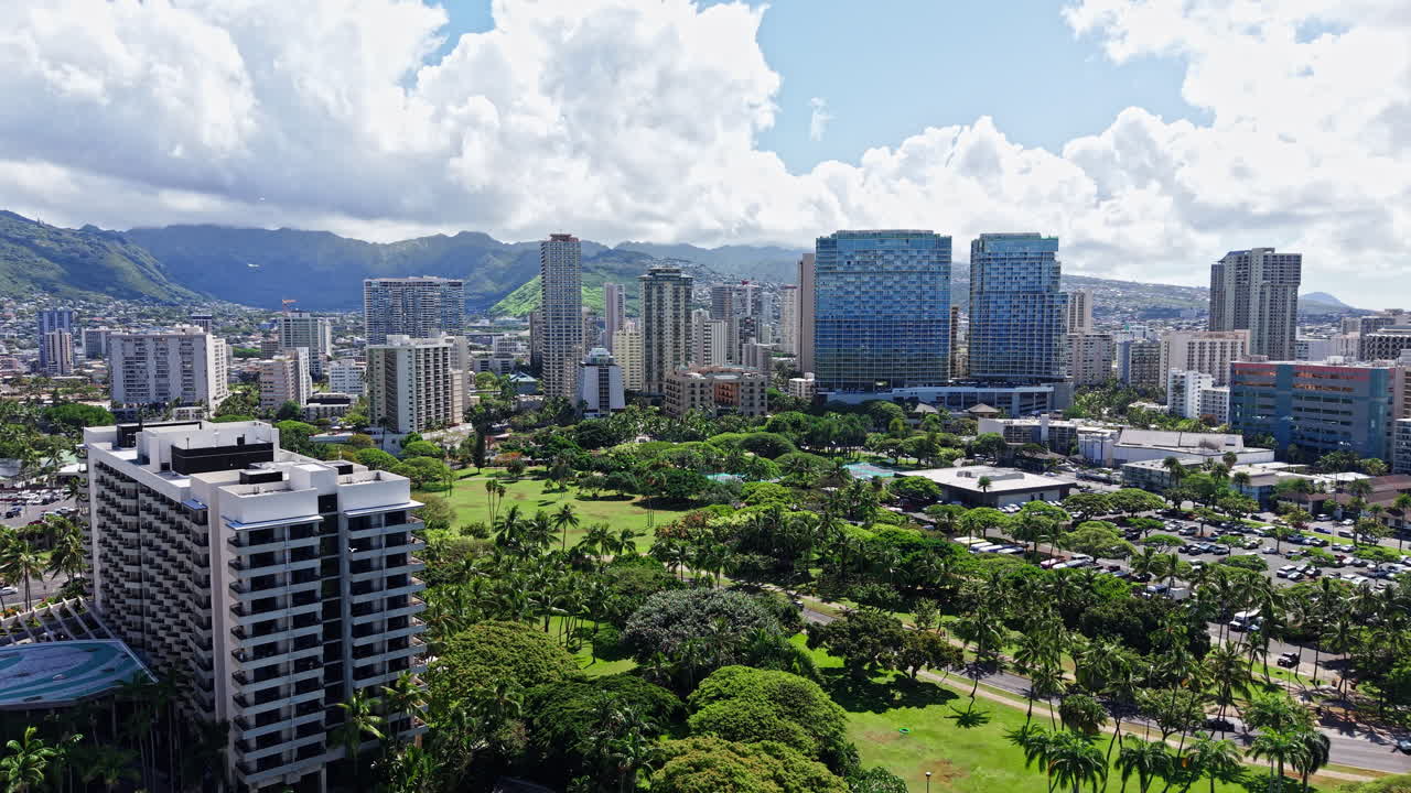 Drone Shot of Honolulu, Hawaii USA, Green Parks Between Condominium and Hotel Buildings