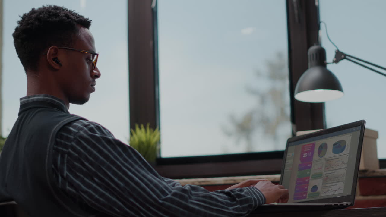Business man using laptop to plan successful investment