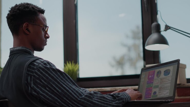 Business man using laptop to plan successful investment