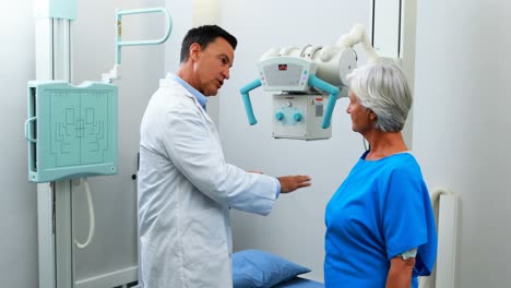 Doctor-interacting-with-senior-woman-during-medical-check-up