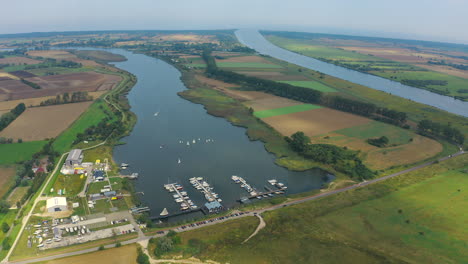 top view, aerial shot of drone flying around marina in blotnik, pomeranian, poland