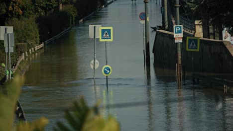 flooded street submerging road signs and sidewalks during the budapest flood of 2024