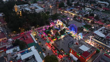 aerial view of a vibrant night market and carnival in a mexican town
