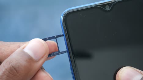 inserting a sim card into a smartphone