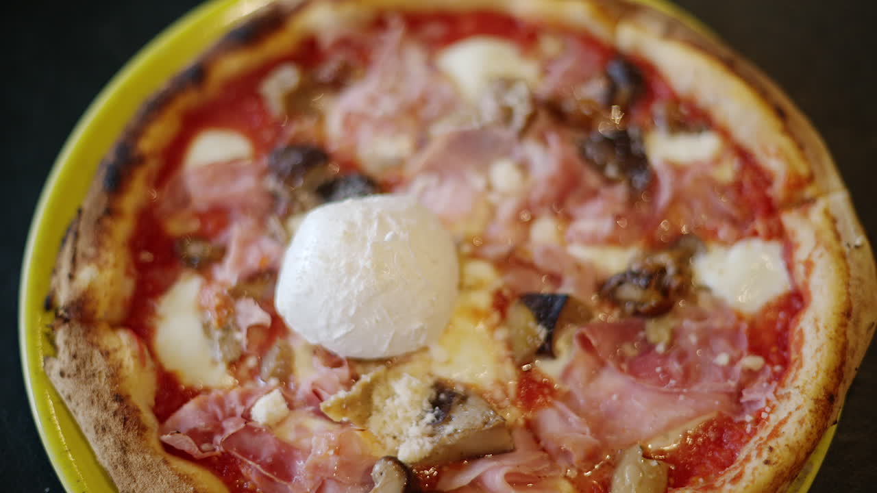 Top down shot of italian pizza with Burrata cheese