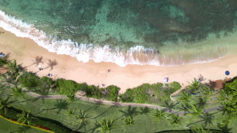 top down view of calm waves golden sand napili beach on maui island, hawaii, usa