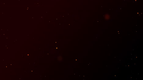 partículas rojas brillantes de luz explotando sobre un fondo negro