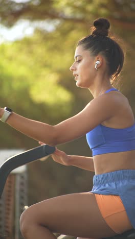 woman exercising on air bike
