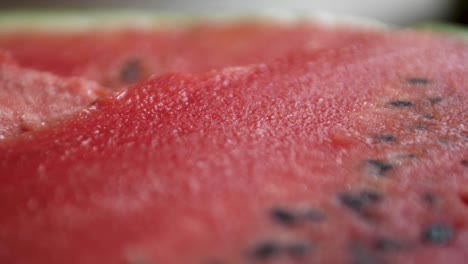 macro dolly shot over the top of a freshly sliced watermelon