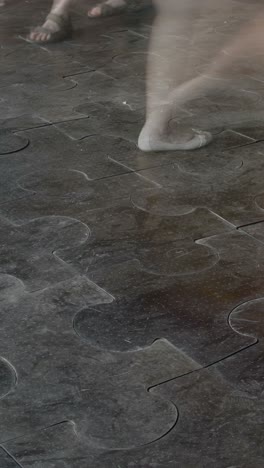 people walking on a patterned composite floor