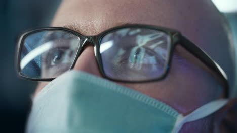 man wearing glasses and mask