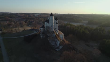 aerial drone view of bobolice royal castle at sunset, poland