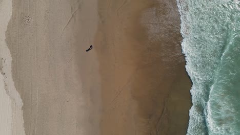 Person-running-on-the-shore-close-to-the-sea