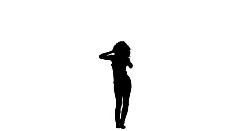 silhouette of a woman moving and dancing