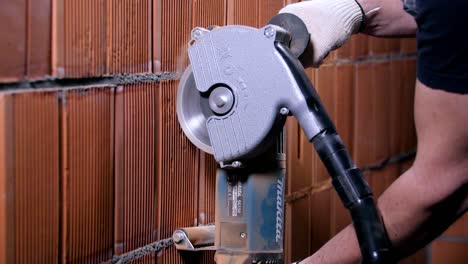 cutting a brick wall with a circular saw