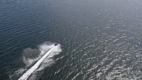 jet ski speeding across water