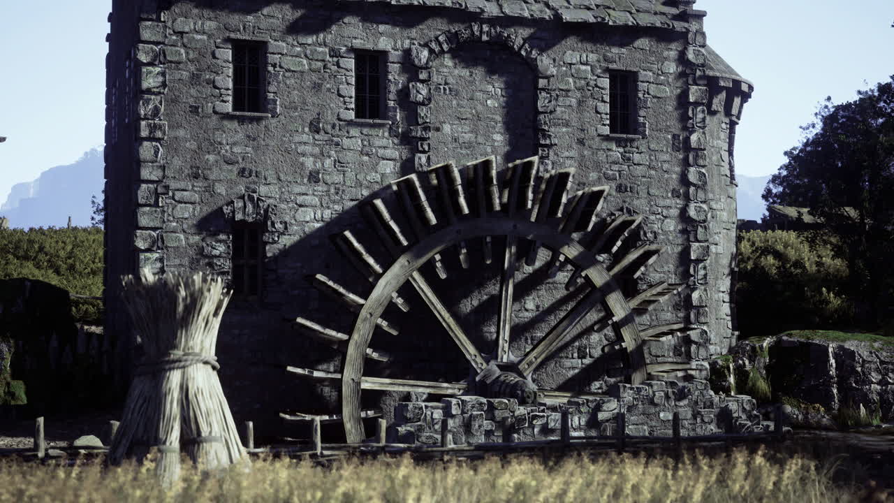 Historic water mill in a serene countryside landscape during daylight
