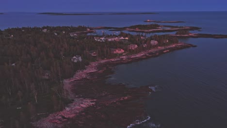 ascending aerial at dusk above newagen southport, maine