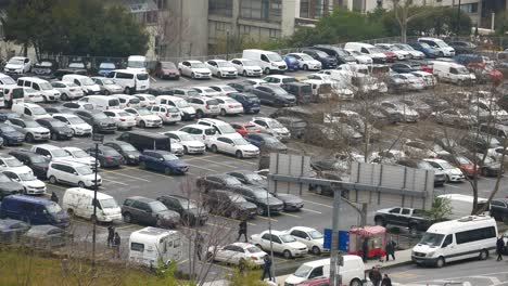 full parking lot in city