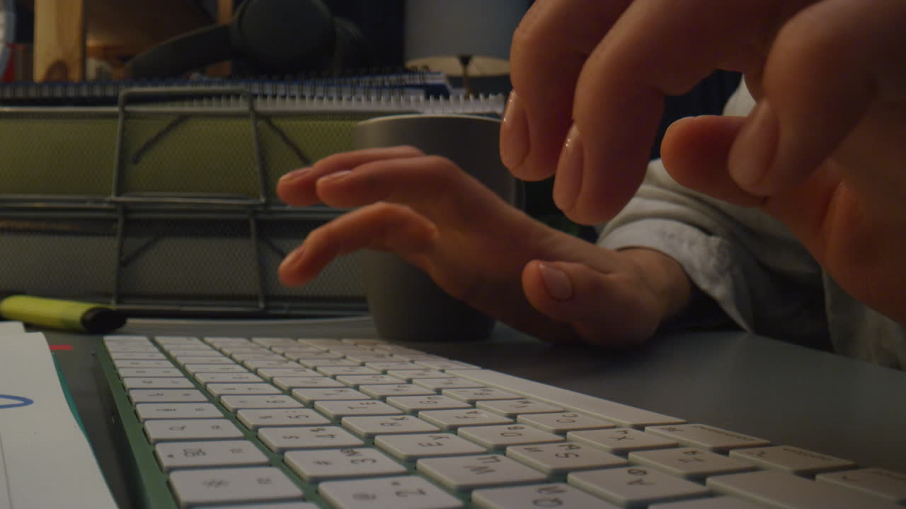 Woman arms pressing buttons at night closeup. Unknown girl typing computer