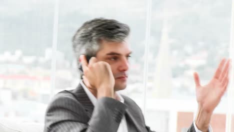 serious businessman on phone