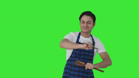 cocinero indio feliz bailando y disfrutando de la pantalla verde