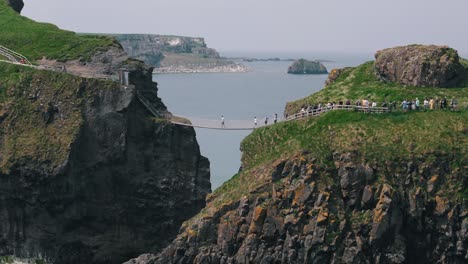 Aerial-Video-Circling-Carrick-a-Rede-Rope-Bridge-in-Northern-Ireland