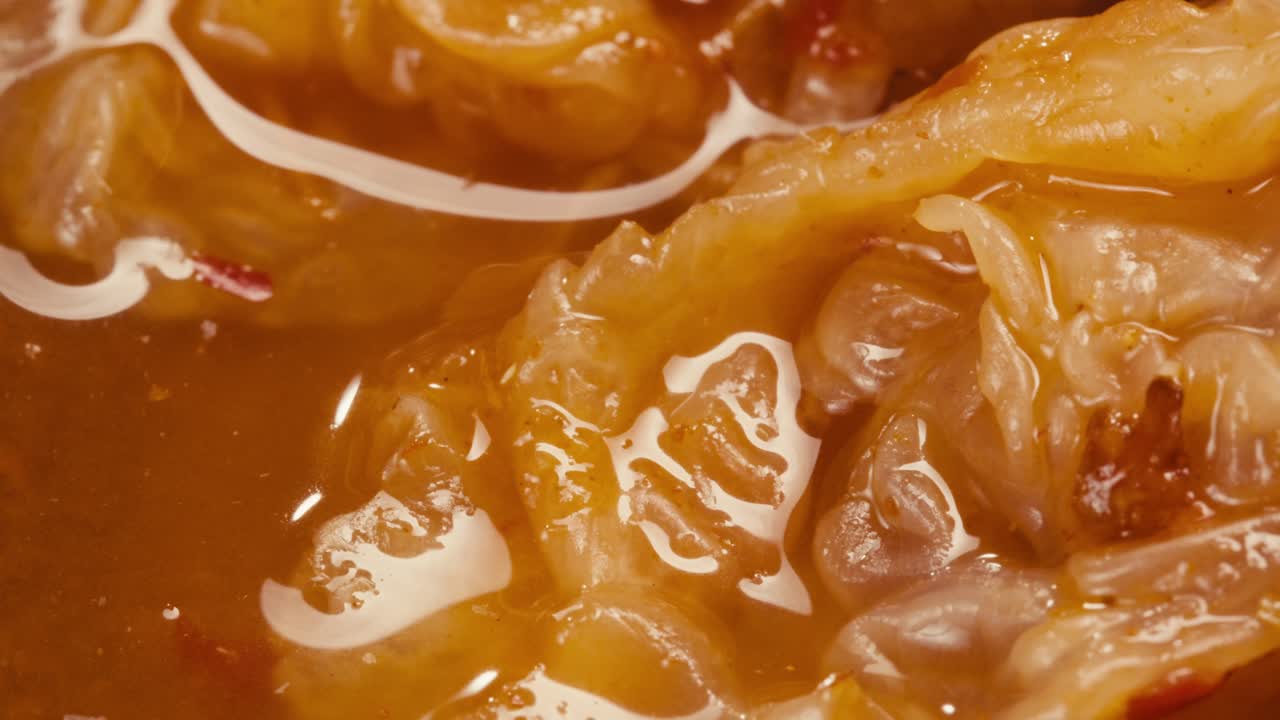 Close-up of texture fermented spicy cabbage kimchi with in can. Preservation of vegetables in glass jars. Fermentation preserved kimchi cabbage with spices macro. Asian cuisine.