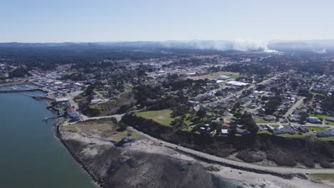 immersive 4k descending aerial of bandon oregon coast line and town