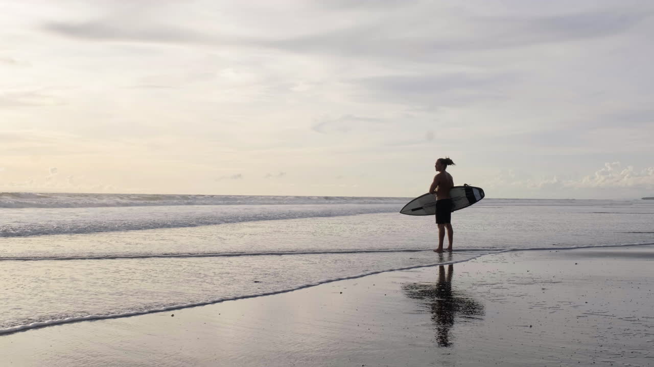 Young man with surfboard