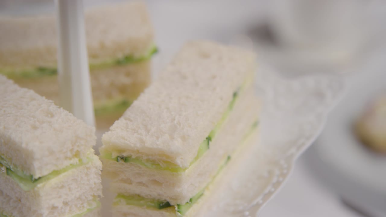 Studio Shot Of Traditional British Afternoon Tea With Sandwiches Cake Scones Cream And Jam 4
