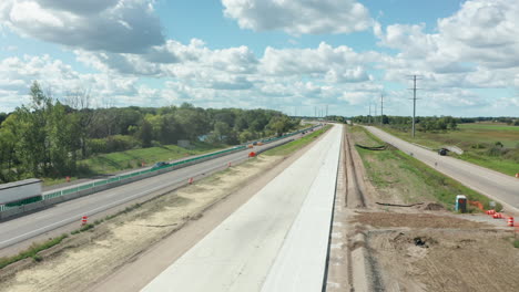 Aerial-view-of-a-new-freeway-under-construction,-outside-on-a-sunny-day