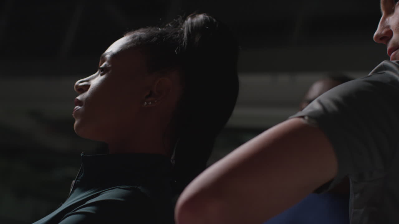 Close Up Of Male And Female Athletes In Fitness Clothing Training In Gym Warming Up And Preparing For Sports Event 1