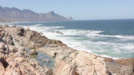 Landscape-of-beautiful-mountains-and-sea-with-blue-sky-on-sunny-day,-in-slow-motion