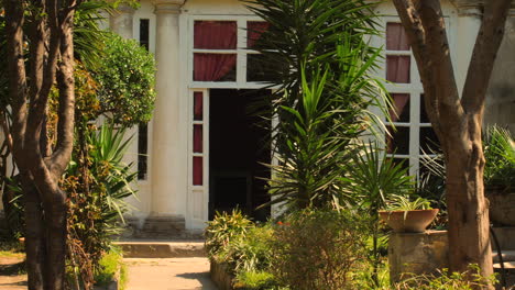 entrance of italian villa with lush garden in naples, italy