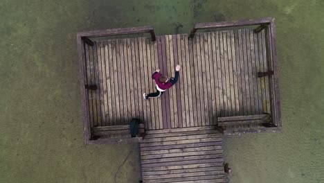 young guy training kickboxing in nature