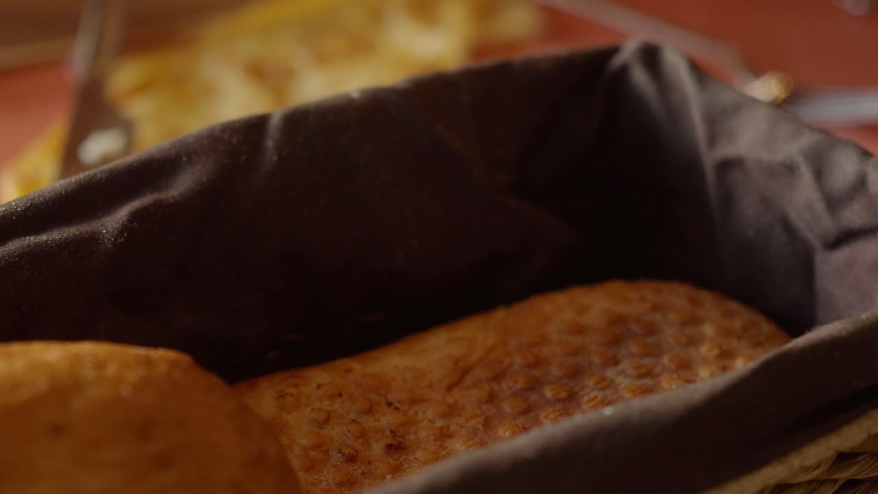 Person Taking Bread From Basket