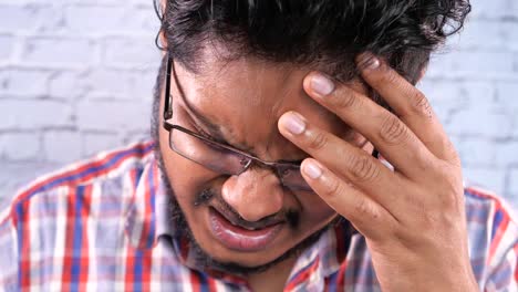 man experiencing headache