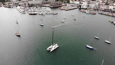 aerial view yacht sailing across falmouth harbour