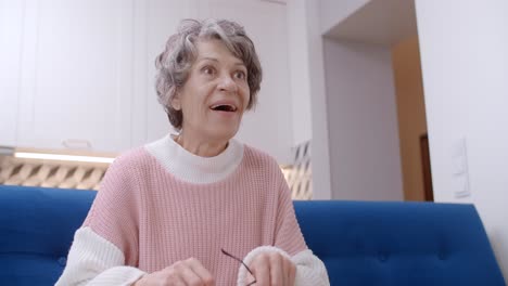 senior woman using phone at home