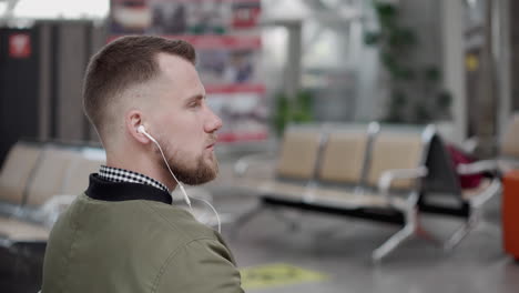 man waiting at airport