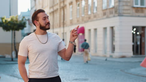 thoughtful man pointing empty place advertising area for commercial text copyspace in city street