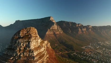 Peak-Of-The-Lion's-Head-And-The-Flat-Landscape-Of-The-Table-Mountains-Under-Blue-Sky-In-South-Africa