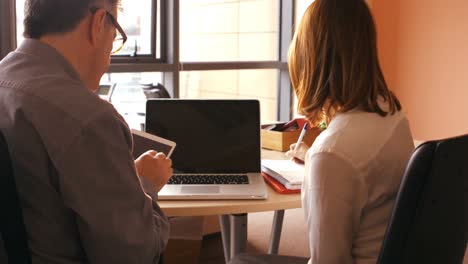 business people using digital tablet and laptop